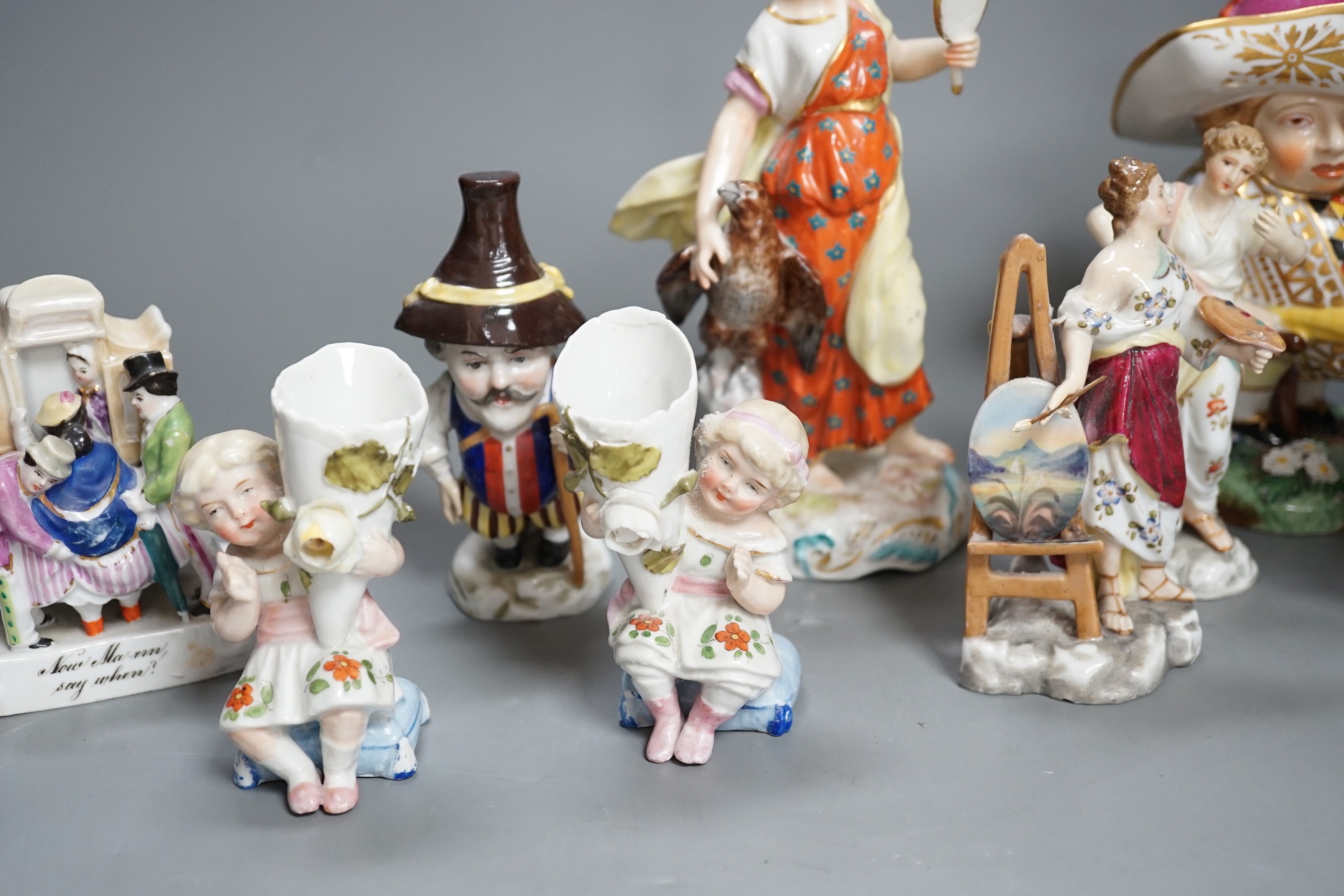 A selection of mainly Continental porcelain figures including Royal Crown Derby style mansion house dwarf